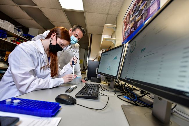 Emily Westemeier, a graduate student, sequences cancer tissue samples with Ivan Martinez, associate professor in the WVU School of Medicine. The University has been maintained its R1 status as a “very high research activity” institution, according to the 